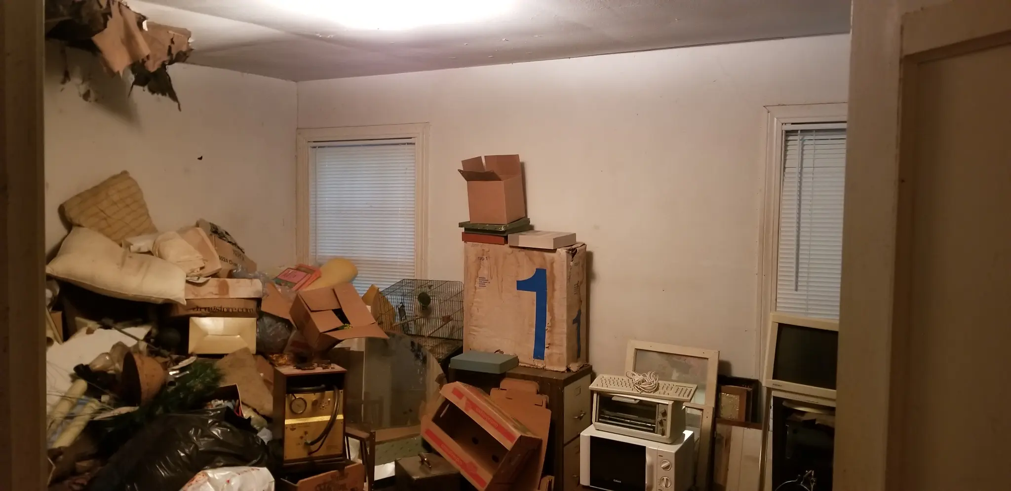 Garland TX house interior packed with storage before purchase - DFW I Buy Houses