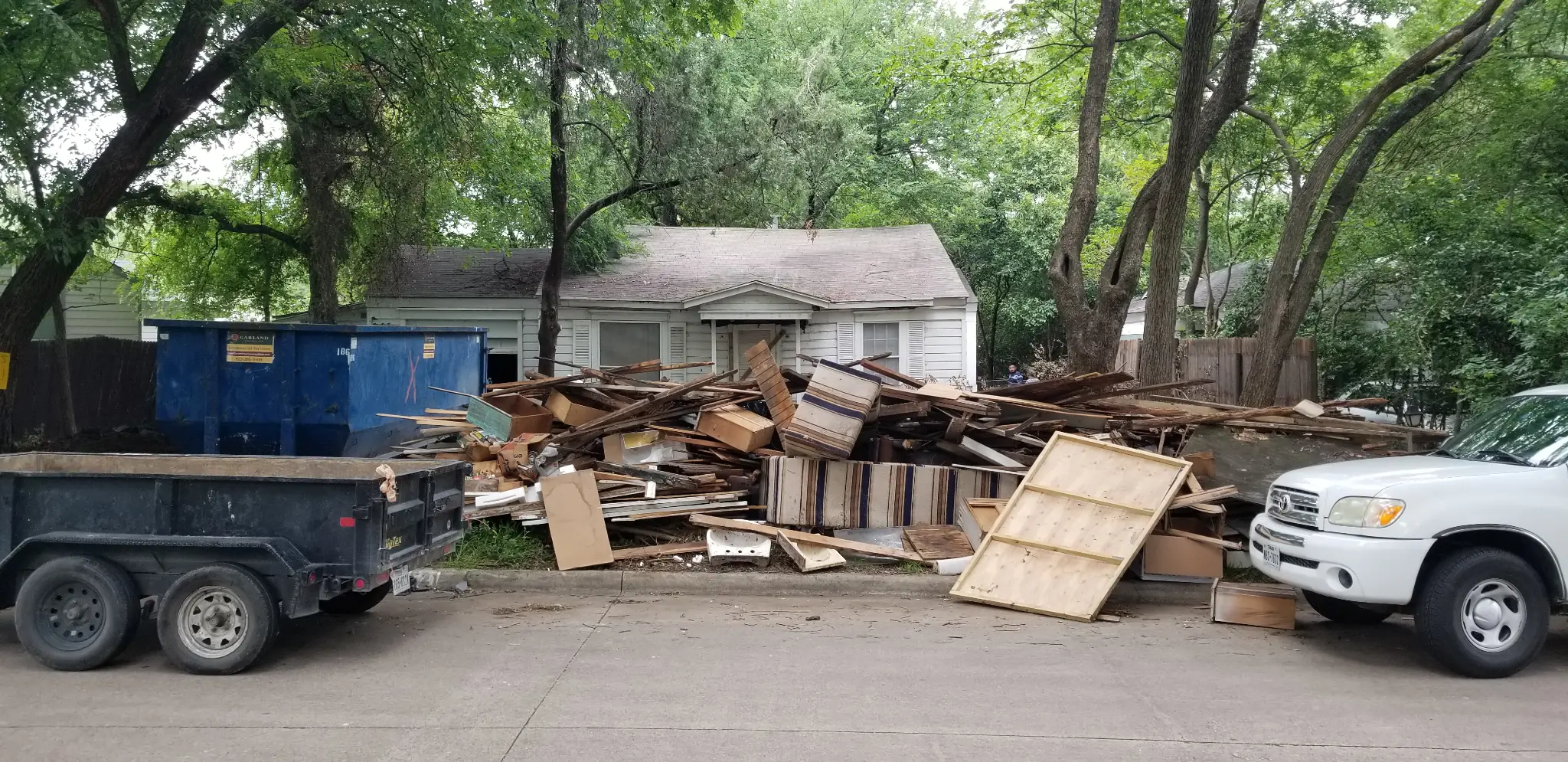 1521 Inwood Blvd, Garland, TX 75042 Garland TX exterior during trash-out after purchase - DFW I Buy Houses