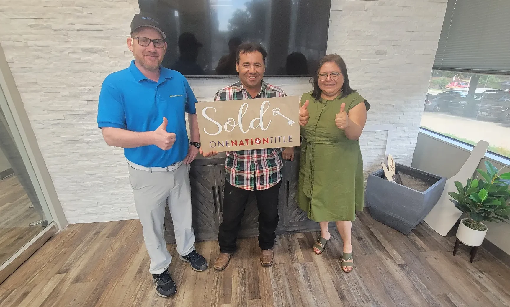 Shannan Coblentz and sellers celebrating a successful cash home sale in Dallas TX — closing day at One Nation Title