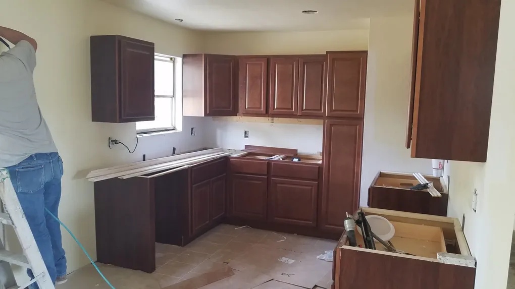 The rough in for the plumbing and electrical are completed and new kitchen cabinets being installed