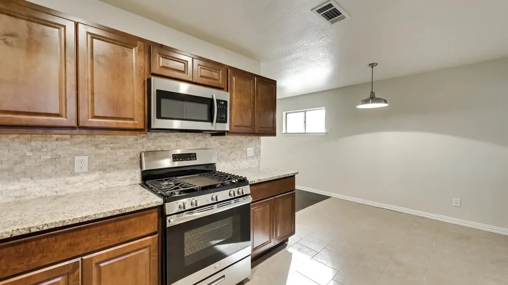 After: Completely updated kitchen with modern finishes