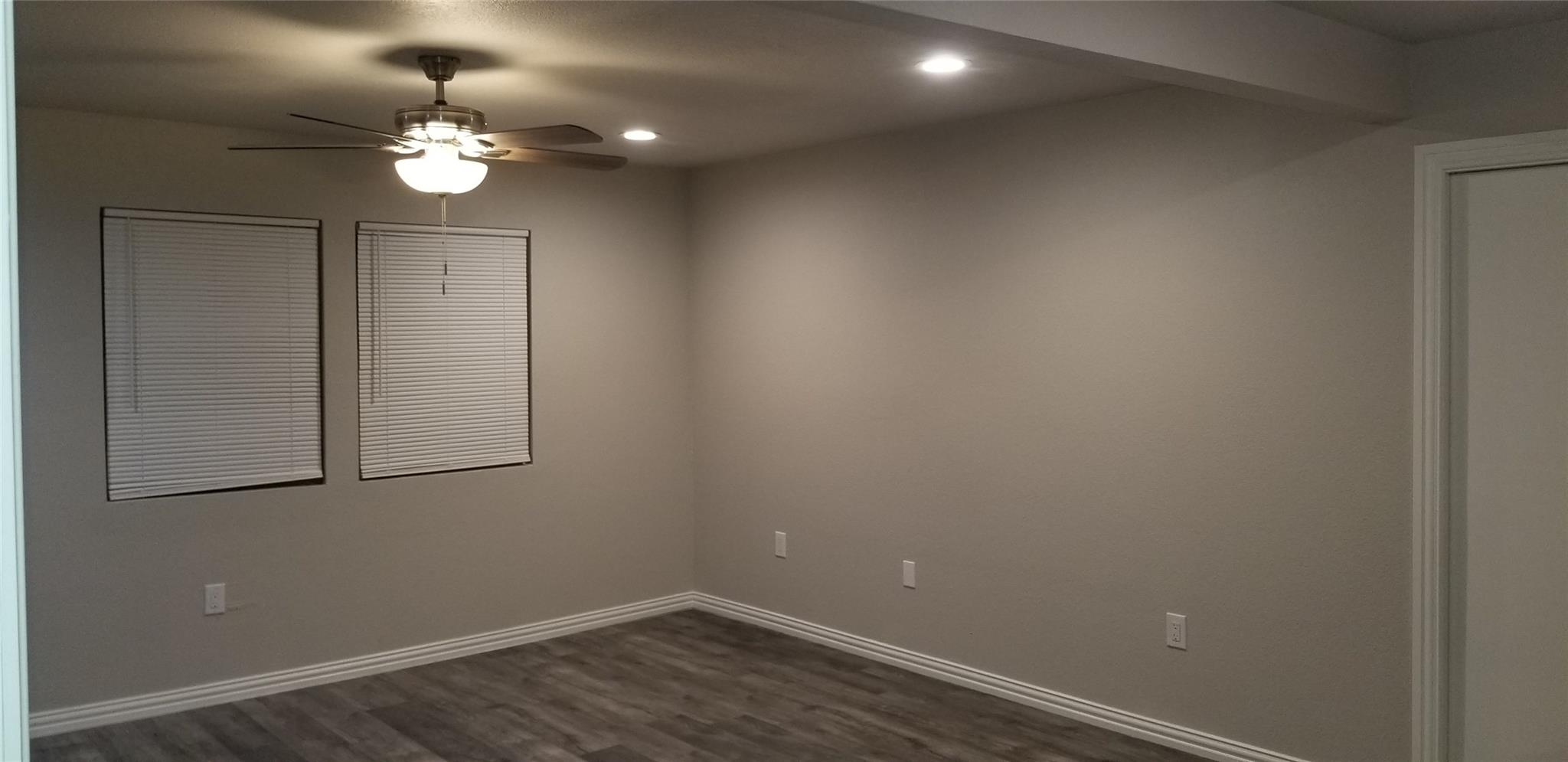 Garland TX house after remodel bright open living room with new flooring - DFW I Buy Houses